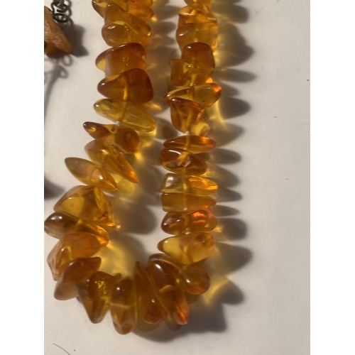 720A - THREE VINTAGE POSSIBLY AMBER NECKLACES