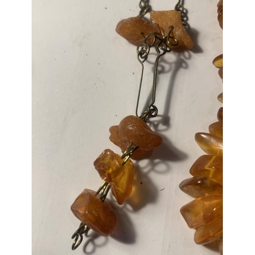 720A - THREE VINTAGE POSSIBLY AMBER NECKLACES