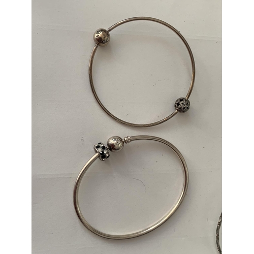 848 - FIVE VARIOUS SILVER BANGLES TO INCLUDE A PANDORA AND A CHAMILIA