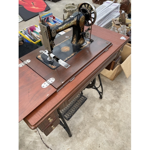 1784 - A VINTAGE JONES SEWING MACHINE WITH TREADLE BASE AND DRAWERS ETC