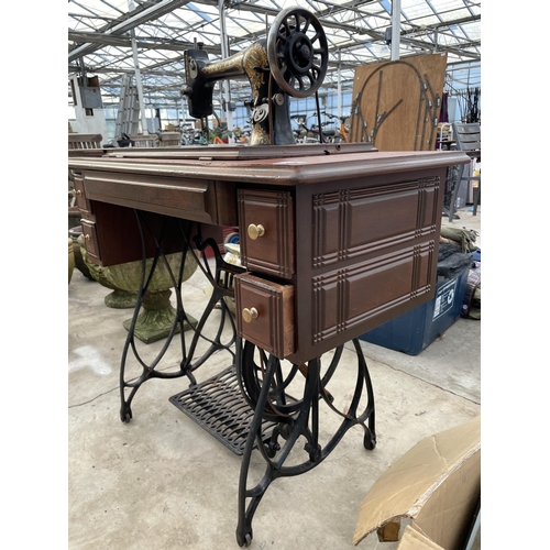 1784 - A VINTAGE JONES SEWING MACHINE WITH TREADLE BASE AND DRAWERS ETC