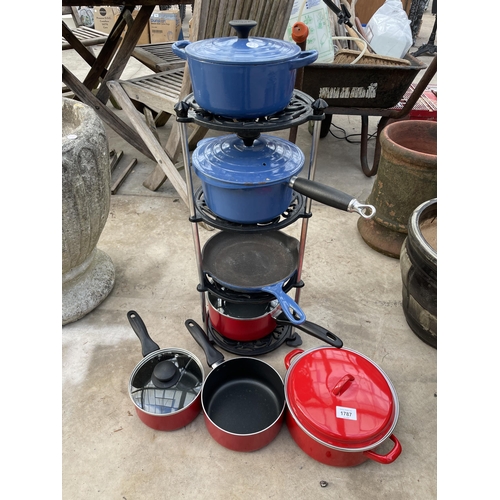 1787 - A PAN STAND WITH AN ASSORTYMENT OF PANS TO INCLUDE THREE BLUE LE CREUSET