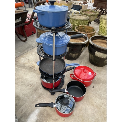 1787 - A PAN STAND WITH AN ASSORTYMENT OF PANS TO INCLUDE THREE BLUE LE CREUSET