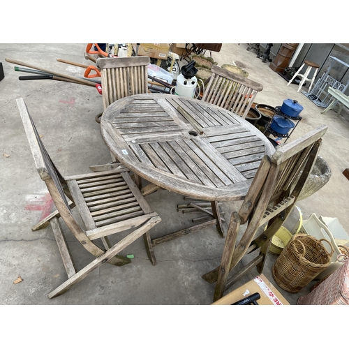 1804 - A TEAK GARDEN FURNITURE SET COMPRISING OF A ROUND TABLE AND FOUR CHAIRS