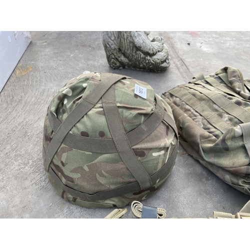 1813 - TWO CAMMO BAGS AND A CAMMO HELMET