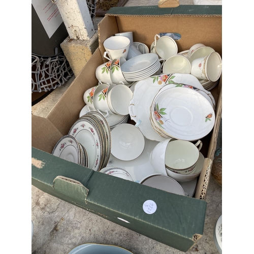 1873 - A LARGE ASSORTMENT OF CERAMIC ITEMS TO INCLUDE PLATES AND CUPS AND SAUCERS ETC