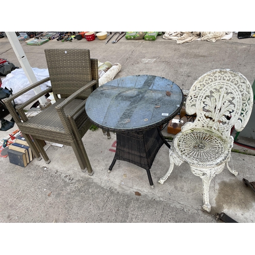 2021 - A ROUND GLASS TOPPED BISTRO TABLE, A CAST ALLOY BISTRO CHAIR AND TWO RATTAN GARDEN CHAIRS