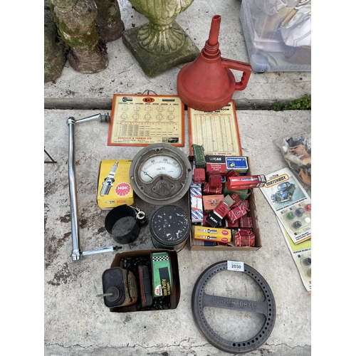 2030 - AN ASSORTMENT OF VINTAGE ITEMS TO INCLUDE SPARK PLUGS, A VOLT METER AND OIL CANS ETC