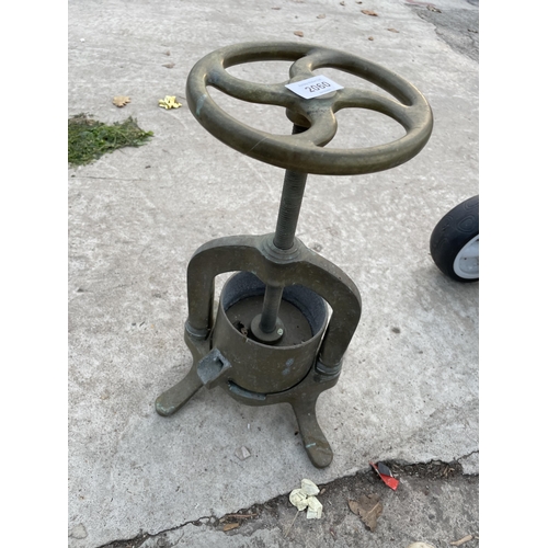 2060 - A VINTAGE BRASS FRUIT PRESS