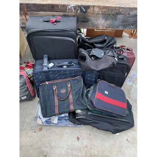 2098 - A LARGE ASSORTMENT OF SUITCASES, HOLDALLS AND TRAVEL CASES ETC