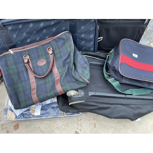 2098 - A LARGE ASSORTMENT OF SUITCASES, HOLDALLS AND TRAVEL CASES ETC