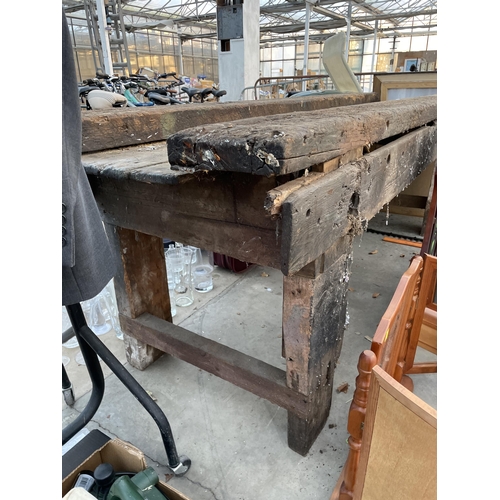 2102 - A LARGE VINTAGE WOODEN WORK BENCH