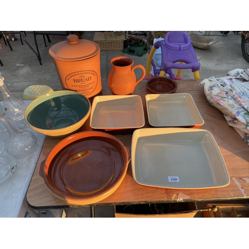 2109 - AN ASSORTMENT OF STONEWARE ITEMS TO INCLUDE A BREAD BIN, JUG AND DISHES ETC