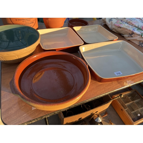 2109 - AN ASSORTMENT OF STONEWARE ITEMS TO INCLUDE A BREAD BIN, JUG AND DISHES ETC