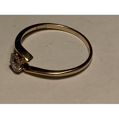 A 9 CARAT GOLD RING WITH A SOLITAIRE CUBIC ZIRCONIA SIZE J/K
