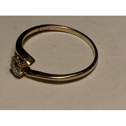 720 - A 9 CARAT GOLD RING WITH A SOLITAIRE CUBIC ZIRCONIA SIZE J/K