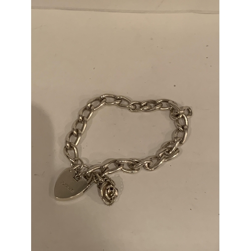 831 - A SILVER BRACELET WITH ROSE CHARM AND A HEART PADLOCK