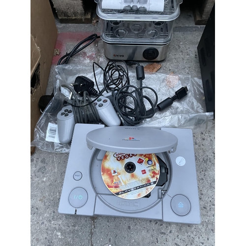 2430 - A PLAYSTATION ONE WITH CONTROLLERS ETC