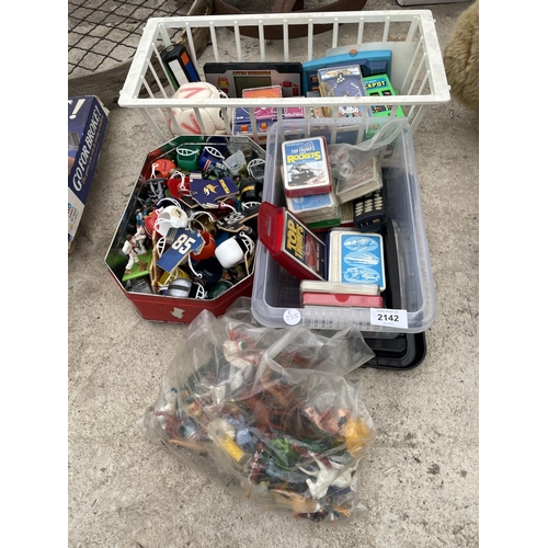 2142 - AN ASSORTMENT OF TOYS AND GAMES TO INCLUDE TOP TRUMPS AND ANIMALS ETC