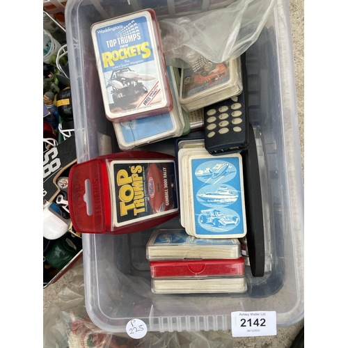 2142 - AN ASSORTMENT OF TOYS AND GAMES TO INCLUDE TOP TRUMPS AND ANIMALS ETC