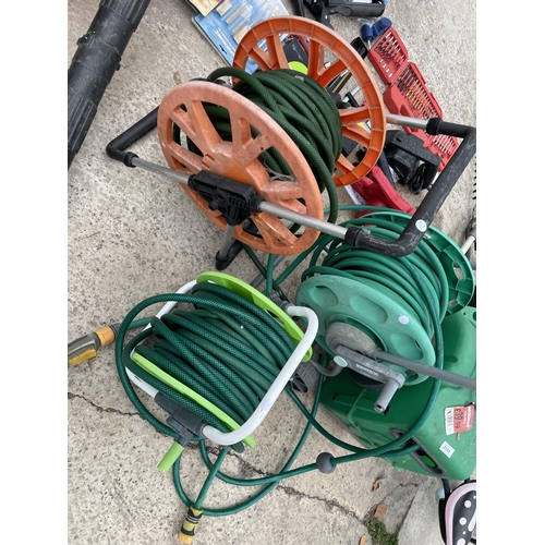 FOUR VARIOUS HOSE PIPE REELS WITH HOSES