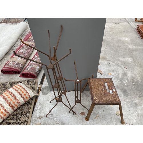 2245 - A METAL STOOL AND THREE METAL SHOP DISPLAY STANDS