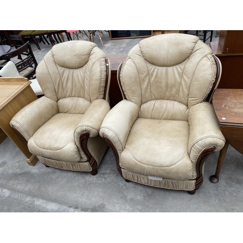 2894 - A PAIR OF 'FLORENCE COLLECTIONS' (MADE IN ITALY) CREAM LEATHER EASY CHAIRS, ON TURNED LEGS