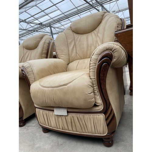 2894 - A PAIR OF 'FLORENCE COLLECTIONS' (MADE IN ITALY) CREAM LEATHER EASY CHAIRS, ON TURNED LEGS