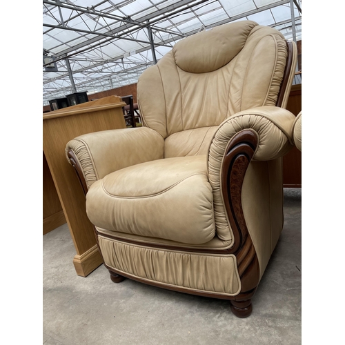 2894 - A PAIR OF 'FLORENCE COLLECTIONS' (MADE IN ITALY) CREAM LEATHER EASY CHAIRS, ON TURNED LEGS