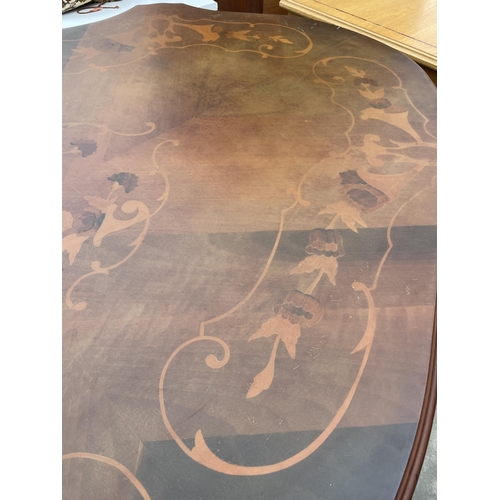 2898 - AN ITALIAN STYLE OVAL INLAID DINING TABLE WITH SHAPED RIM, ON PEDESTAL BASE, 68 X 43