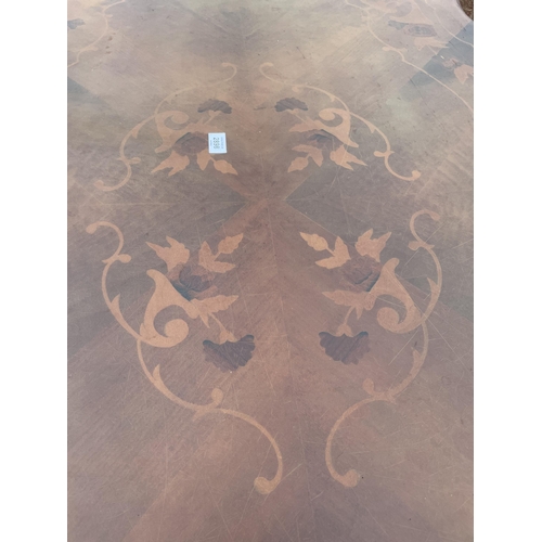 2898 - AN ITALIAN STYLE OVAL INLAID DINING TABLE WITH SHAPED RIM, ON PEDESTAL BASE, 68 X 43