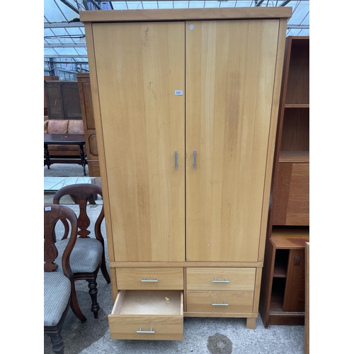 2906 - A MODERN TWO DOOR WARDROBE WITH FOUR DRAWERS TO THE BASE, 40