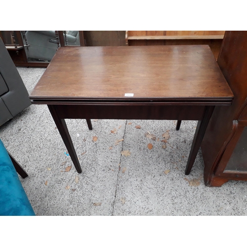 2917 - A 19TH CENTURY MAHOGANY FOLD-OVER GAMES TABLE, 36