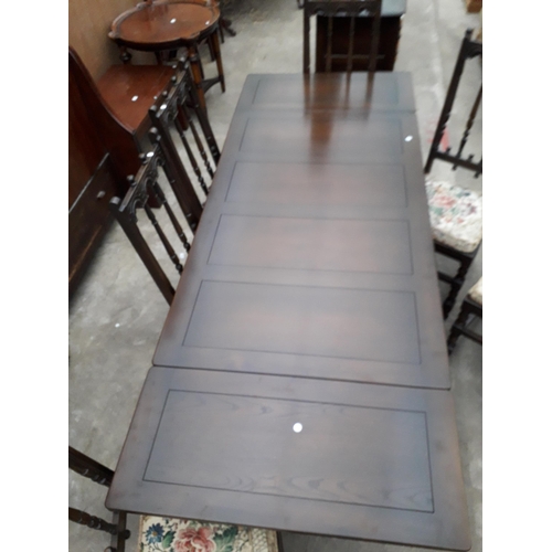 2931 - AN ERCOL COLONIAL STYLE DRAW-LEAF DINING TABLE, 54 X 33