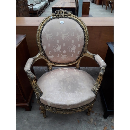 2961 - A CONTINENTAL STYLE GILT OPEN ARMCHAIR WITH FOLIATE DECORATION