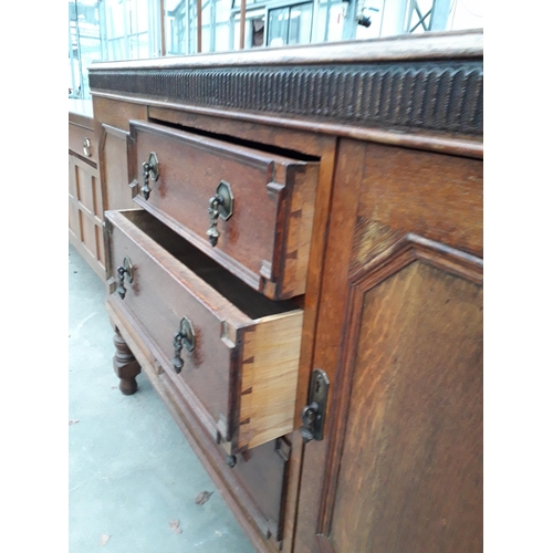 2964 - AN EARLY 20TH CENTURY OAK JACOBEAN STYLE SIDEBOARD WITH RAISED BACK, 56