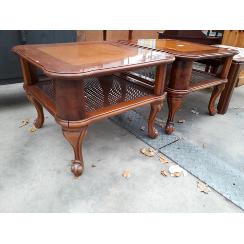 2969 - A PAIR OF BURR WALNUT LAMP TABLES WITH CANE MAGAZINE SHELF