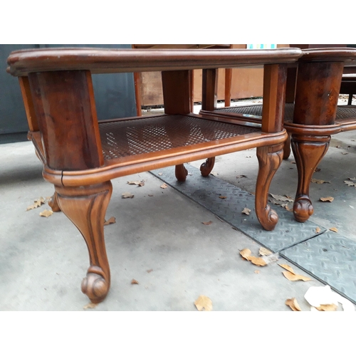 2969 - A PAIR OF BURR WALNUT LAMP TABLES WITH CANE MAGAZINE SHELF