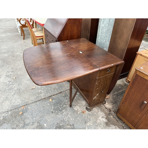 2972 - A 1950s OAK DROP LEAF DINING TABLE