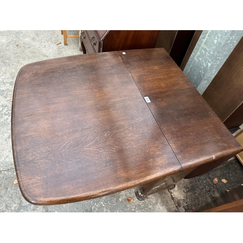 2972 - A 1950s OAK DROP LEAF DINING TABLE