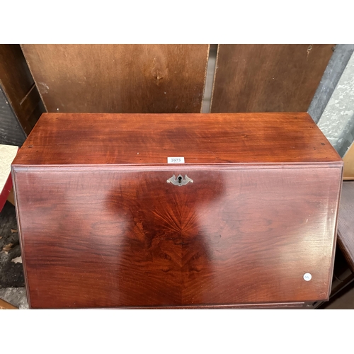 2973 - A MAHOGANY BUREAU ON CABRIOLE SUPPORTS WITH FALL FRONT AND TWO DRAWERS