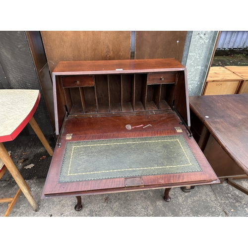 2973 - A MAHOGANY BUREAU ON CABRIOLE SUPPORTS WITH FALL FRONT AND TWO DRAWERS