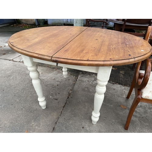 2975 - A MODERN OVAL PINE EXTENDING DINING TABLE, 50 X 39