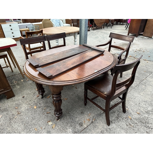 2976 - AN OVAL MAHOGANY DINING TABLE WITH TWO EXTRA LEAVES AND FOUR DINING CHAIRS (INCLUDING ONE CARVER)