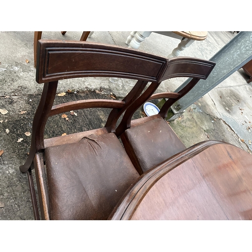 2976 - AN OVAL MAHOGANY DINING TABLE WITH TWO EXTRA LEAVES AND FOUR DINING CHAIRS (INCLUDING ONE CARVER)