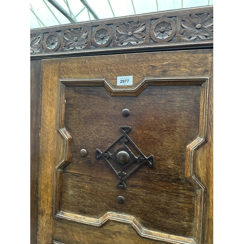 2977 - A GOTHIC STYLE OAK HALL WARDROBE