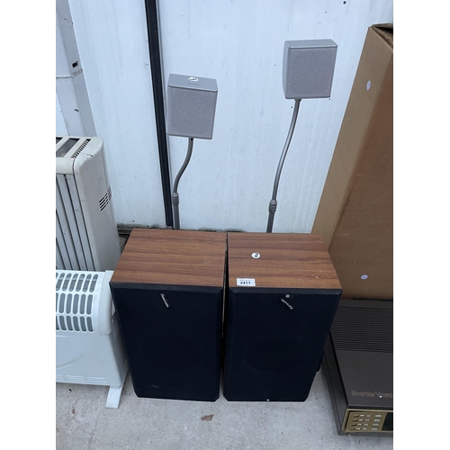 2411 - A PAIR OF WOODEN CASED PANASONIC SPEAKERS AND A PAIR OF SONY SPEAKERS ON STANDS