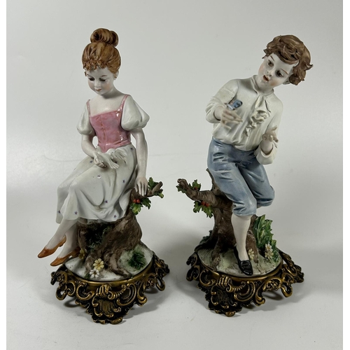 120 - A PAIR OF CONTINENTAL PORCELAIN FIGURES OF A BOY AND GIRL ON GILT METAL BASES