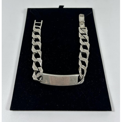 554 - A HEAVY .925 SILVER CURB BARK EFFECT IDENTITY BRACELET, 9.5