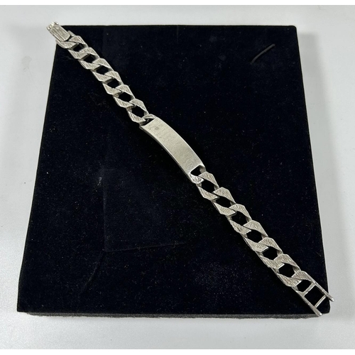 554 - A HEAVY .925 SILVER CURB BARK EFFECT IDENTITY BRACELET, 9.5